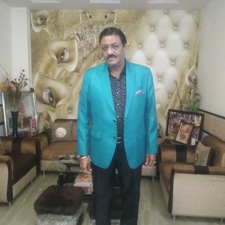 Rajesh Bajaj, founder of Star Musical Entertainer, performing live with a microphone