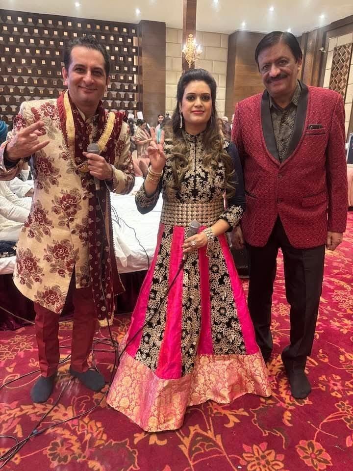 Rajesh Bajaj with performing artists at a wedding celebration
