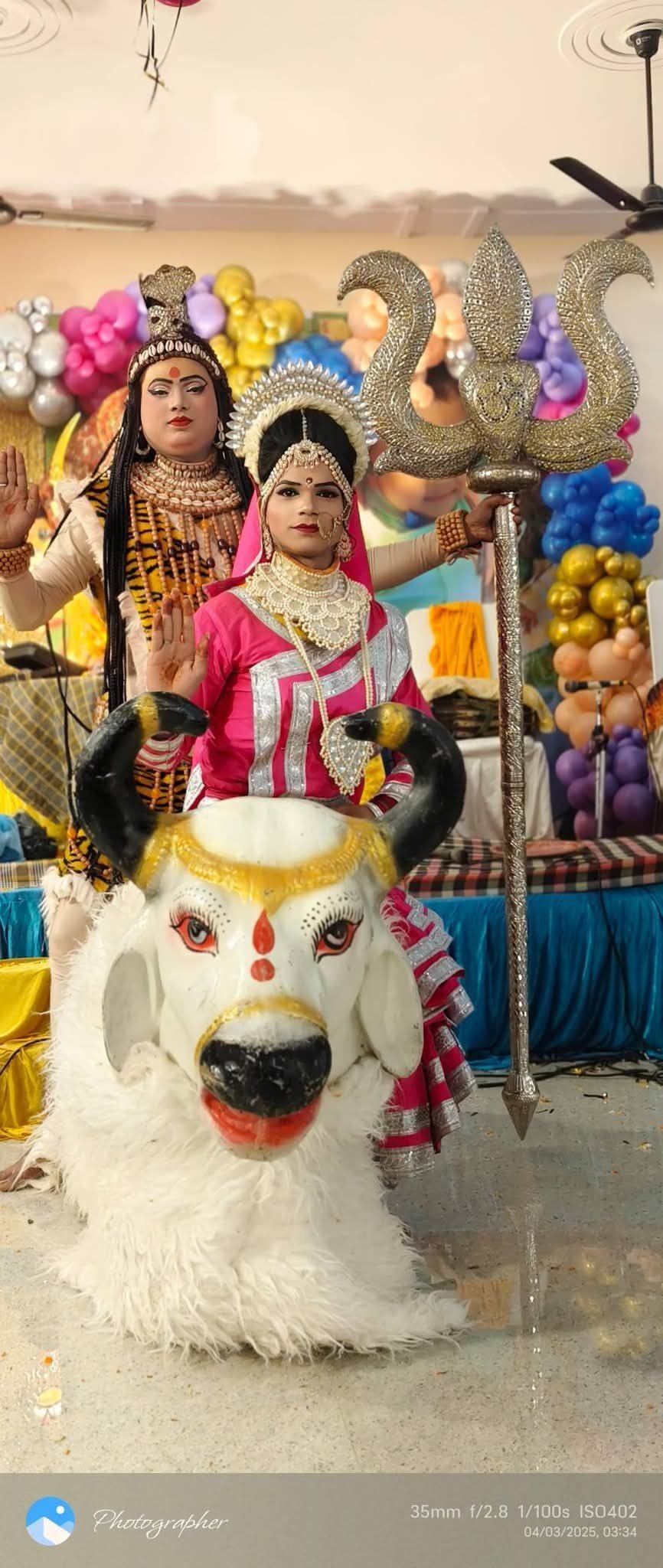 Couple on a decorated wedding stage during the main ceremony