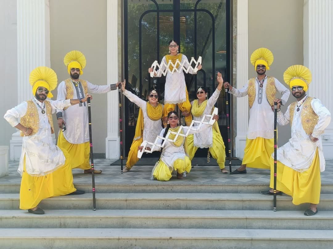 Welcome performers greeting guests at the entrance of a wedding venue